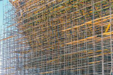 Fototapeta premium Building crane and building under construction