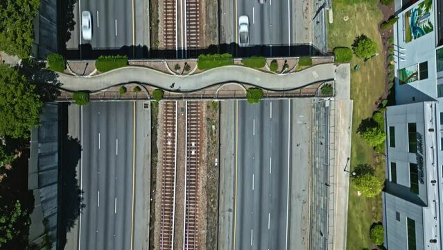 Pedestrian Footbridge Over T. Harvey Mathis Parkway In State Route 400 In Buckhead, Atlanta, Georgia, USA. Aerial Topdown Shot