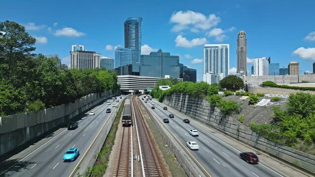 Vehicles Driving Through T. Harvey Mathis Parkway To Downtown Buckhead In Atlanta, Georgia, USA. Aerial Wide Shot