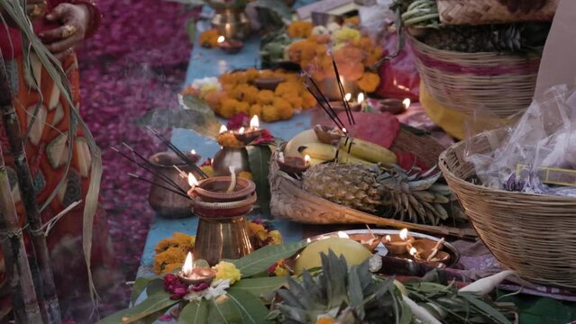 holy religious offerings with oil lamp and fruits for hindu sun god at chhath festival