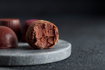 Delicious gourmet chocolate handmade truffles from confectionery, homemade dark chocolate candies...