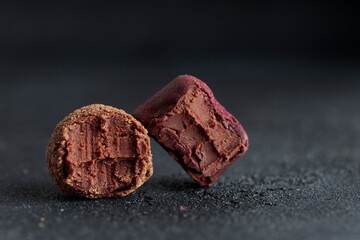 Delicious gourmet chocolate bited truffles from confectionery, homemade dark chocolate candies on...