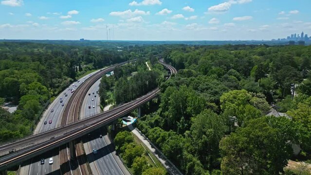 Elevated Railroad Bridge Over T. Harvey Mathis Parkway, State Route 400 In Buckhead, Atlanta, Georgia, USA. Aerial Shot