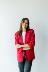 Confident woman smiling in bright office space during daytime