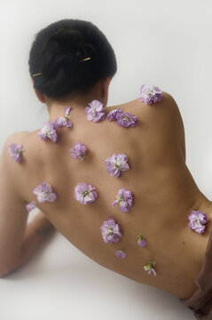 female back with flowers