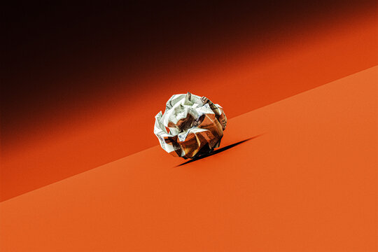Crumpled One Hundred American Dollars on Slant, Orange Surface