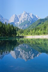 Lake Jasna in the Julian Alps with a view of the mountains reflected in the lake