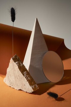 Geometric still life with earthy tones and textures.