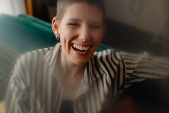 Queer Joy - intimate closeup woman laughing