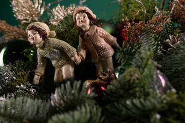 Figurines Sitting on Top of a Christmas Tree