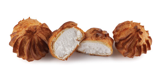 Cut in half and whole porophytroles with white cream isolated on a white background. Eclair with cream.