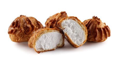 Cut in half and whole porophytroles with white cream isolated on a white background. Eclair with cream.
