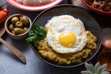 Quinua quinoa stew stu with fried egg Buffet table full of lunch assorted dishes Peru Peruvian food