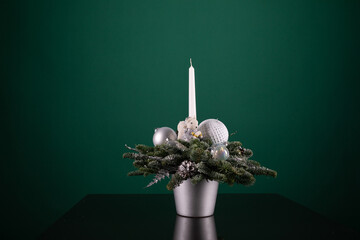 Silver Vase With Christmas Decorations and White Candle