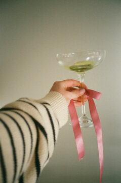 A hand holding a drink