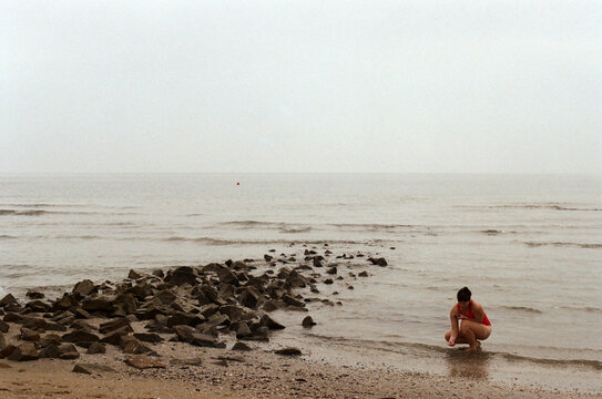 A woman collecting shells