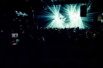Unrecognizable people on stage during concert in club