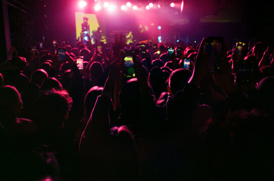 Crowd of people on stage. Local music performer.