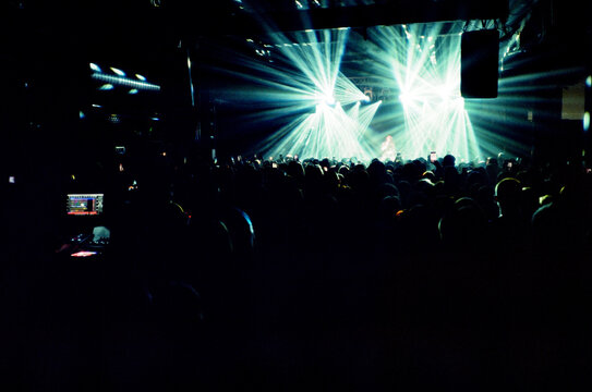 Unrecognizable people on stage during concert in club