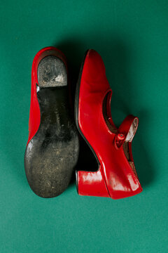 pair of worn red flamenco shoes