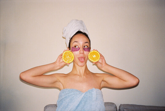 Funny film photo of woman with oranges