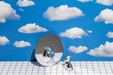 still life with a rabbit and the reflection of an egg in the mirror