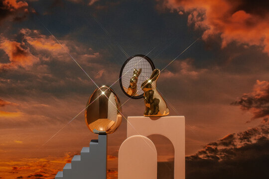 Conceptual still life with Easter bunny and golden egg and sky