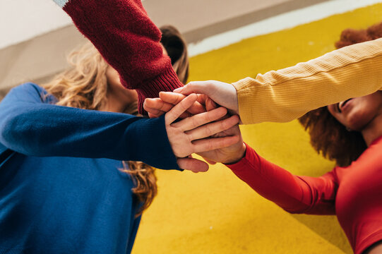 Girls Bonding with Hand Stack in Urban Setting