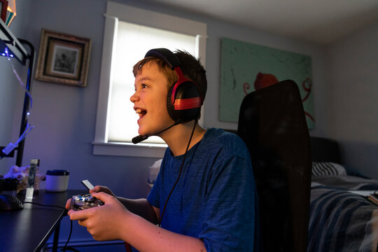 Young Boy Potrait  Gaming on Computer at home bedroom 