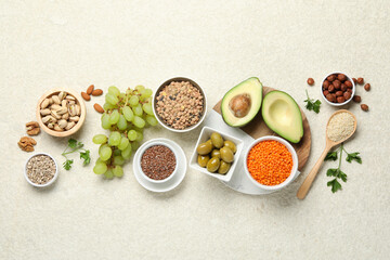 Different products high in natural fats on light table, flat lay