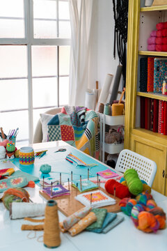 Colorful home crafting corner with knitting supplies