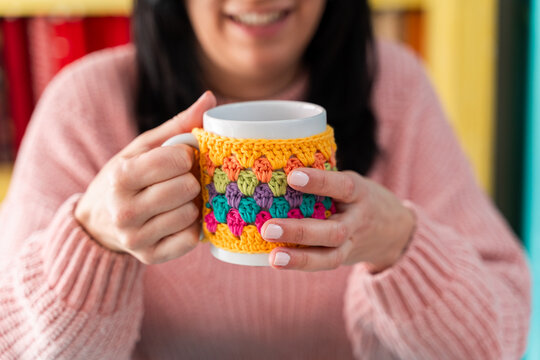 Cozy moment with knitted mug cozy
