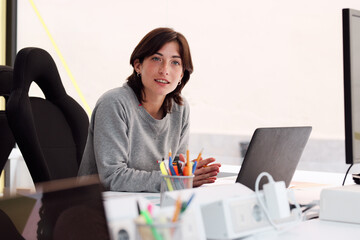 Confident Professional at Her Workspace