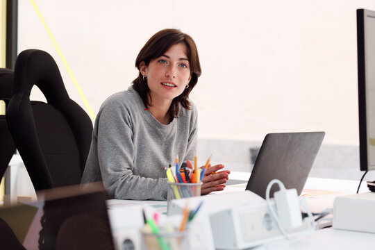Confident Professional at Her Workspace