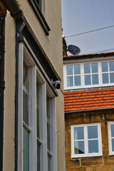Security camera on building corner Robin Hood's Bay, Yorkshire