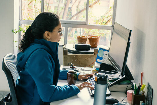 Woman Working from Home Office with Complete Setup