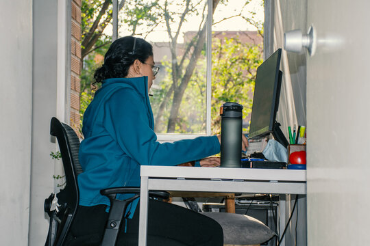 Woman Working from Home Office with Complete Setup