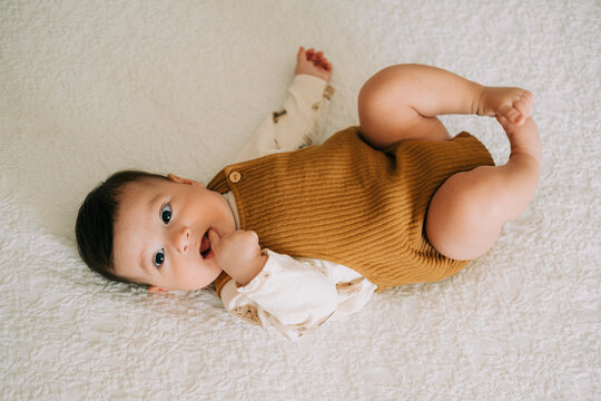 Baby lying down on bad