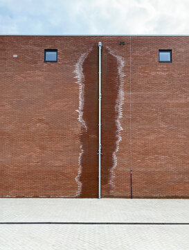 brick wall with drainpipe