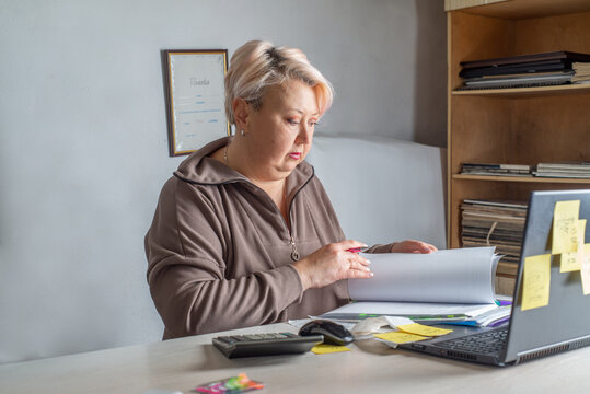 Female accountant working with documents in the office