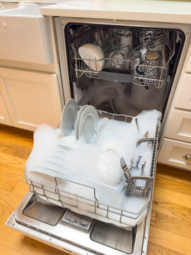 Dishwasher overflow in kitchen overflow with suds soap