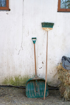 Farm Cleaning Tools Against Wall