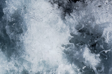 a close up for white water waves crashing