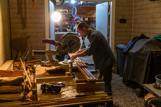 Construction Carpenter job cutting wood with saw home rernovation