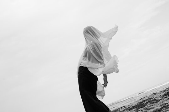 Abstract female dance on beach in sunrise