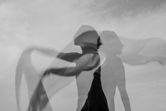 Abstract female dance on beach in sunrise