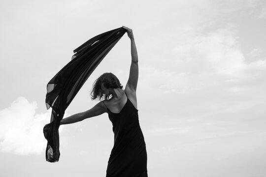 Abstract female dance on beach in sunrise
