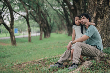 Fototapeta premium Happy father and daughter hugging while standing at countryside,Father'day concept,enjoying tender moment