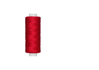 Red spool of sewing thread isolated on white background close up