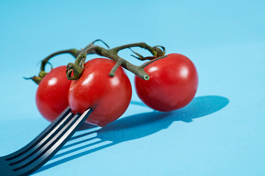 cherry tomatoes in the tip of a fork